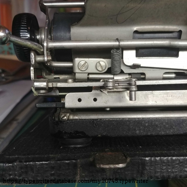 Two holes for riveting the right-hand carriage lever would normally be present.