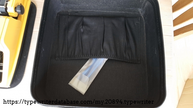 the bottom half of the case, and the pouch with tools that come with