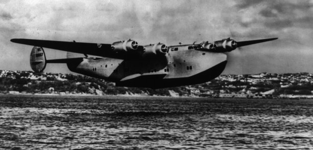 A Boeing B-314 flying boat performing the same maneuver as the B-314 in the decal.