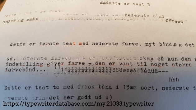 a look at how it types with a standard 13mm red/black ribbon. It's clear it was made for a 20mm width, since the colours mix and match at random.