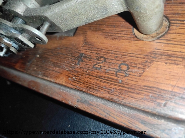 No idea what this means. Sometimes a number like this one is in the wooden hood. This one has in engraved into the bottom plate. Maybe it's the 428th typewriter intended to be imported by Ruys Handelsvereeniging? More info would be much appreciated!