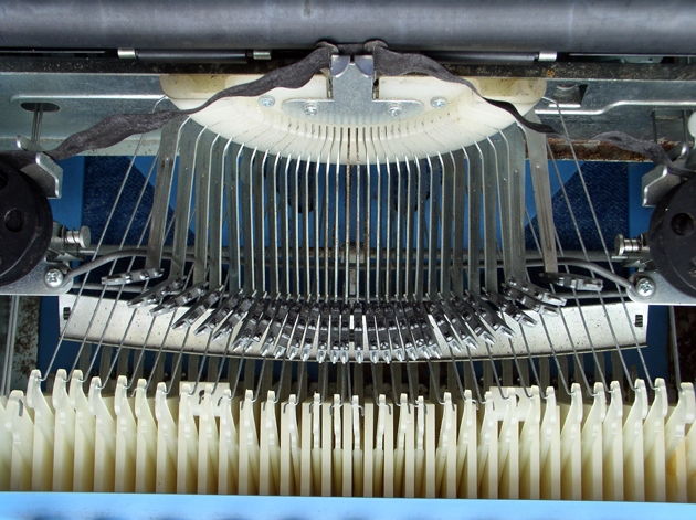 Probably the cheapest possible typewriter; plastic segment and levers; very thin stamped metal frame and typebars; no tabs, of course, and what's more, i.e., less, is that there are no margin stops.