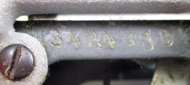 The serial number, which is revealed by moving the carriage all the way to the right.