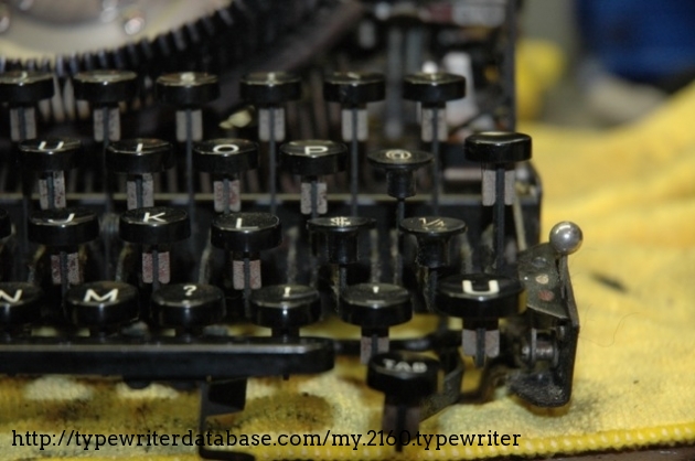 Detail of the key caps - the three foreign (Remington?) caps.