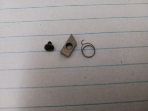 Some missing pieces of the margin bell mechanism I found in a rolled up piece of tape under the typewriter. I am still currently missing a tiny bit to stop the trapezoid from moving too far, so if anyone knows where I can find that, I would finally be able to get the bell working!