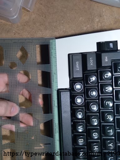 Front keyboard held up to a ruler