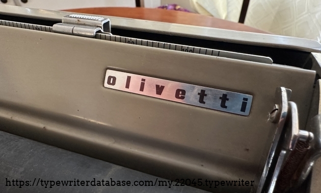 Olivetti logo on the carriage of the machine.