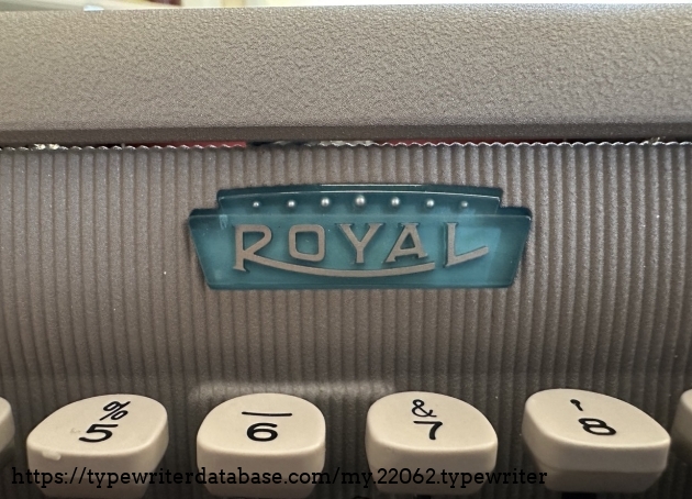 Detail view of Royal emblem. Pressing emblem will open the top lid of typewriter. This is the case for the other Royal typewriter (FPE) that I own