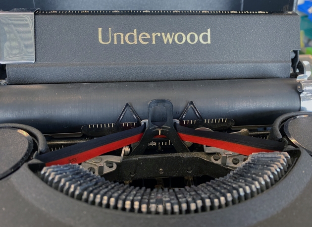 Underwood "Noiseless 77" from the maker logo on the top...(detail)