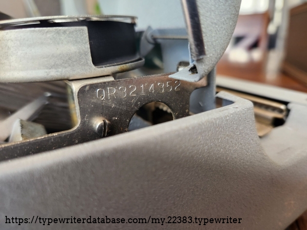 The serial number on the Remington Quiet-Riter can be found stamped into the chassis on the right hand side of the machine on a piece of metal next to the ribbon spool underneath its hood.