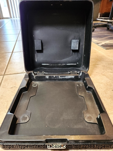 Notice the plastic insert in the bottom of the case. This is form fitting to the typewriter. It is secured by a simple friction fit. The downside of this is that it can wear the typewriter. Note the back of the insert where it has abraded the back plate of the typewriter.