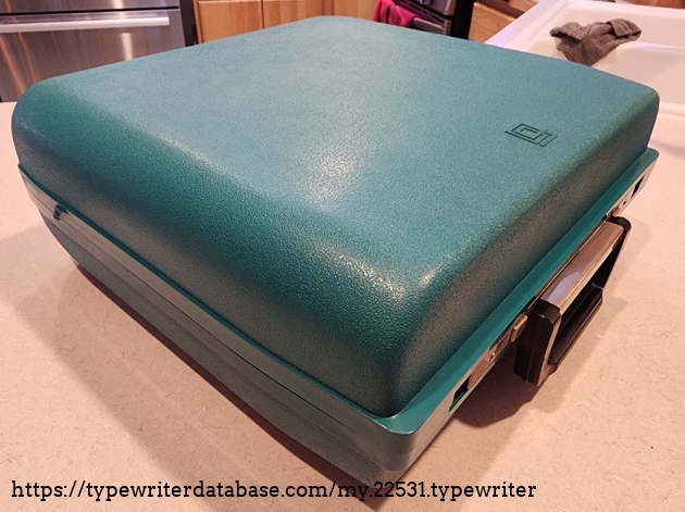 Big green plastic case reminds me of a Samsonite briefcase.