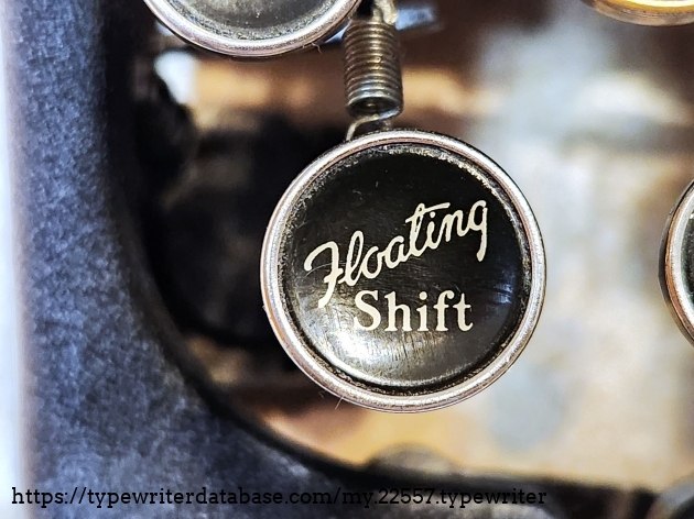 The Corona 1-5 series portables are called the "Floating Shift" typewriters because of this label, denoting the ease of which shifting is done, being a basket shift that is carefully counterbalanced, rather than a carriage shift.