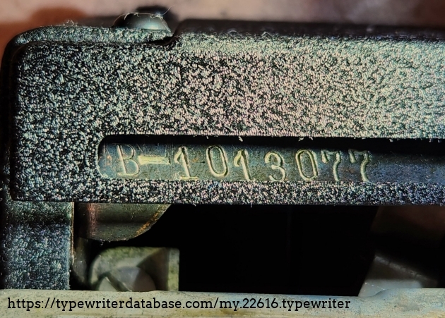 Serial number B-1013077
Located back left, below the carriage.