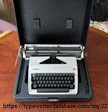 The typewriter sits in a nice plastic retainer. It is a study case.