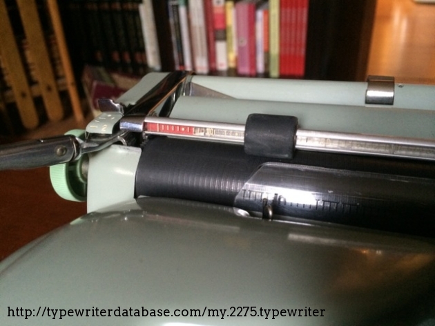 The paper bale/margin tape assembly EXPLODED in my hands when I mistakenly used it as a handle when tipping the machine. The spring was a total loss. I re-assembled it with smaller springs and a piece of elastic cording. It's not perfect, but it's back together .
I have had to completely disassemble and re-assemble the margin tape system, so ping me with any questions if you need help with yours. It's dubious honor, I assure you! :-)