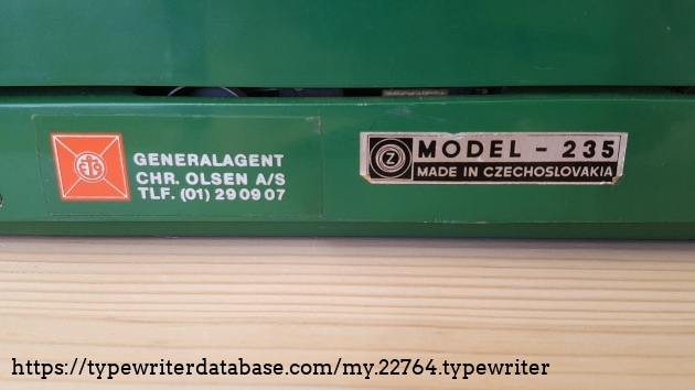 model name on the right side, and the sticker of the Danish retailer on the left.