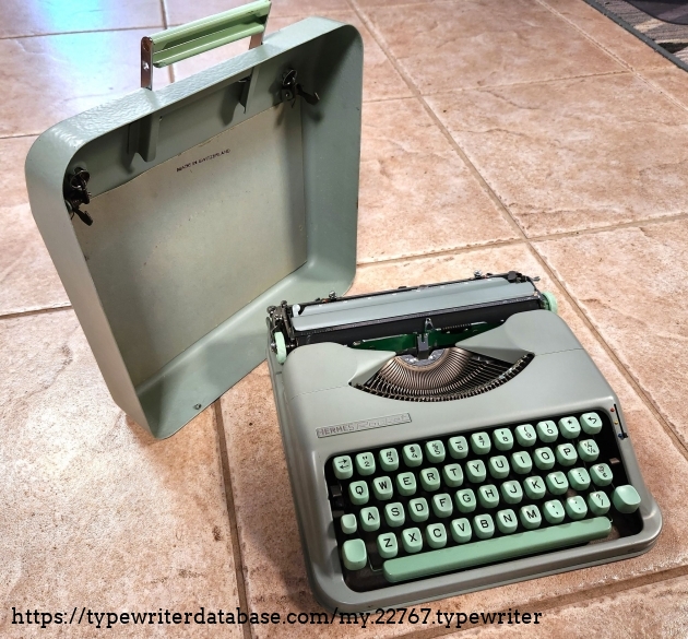 The carrying case is not a case. Rather, it;s a cover that snaps onto the typewriter. Line the pins up in the back, then bring the front down and give it a gentle tap. Pull out the handle and off you go!