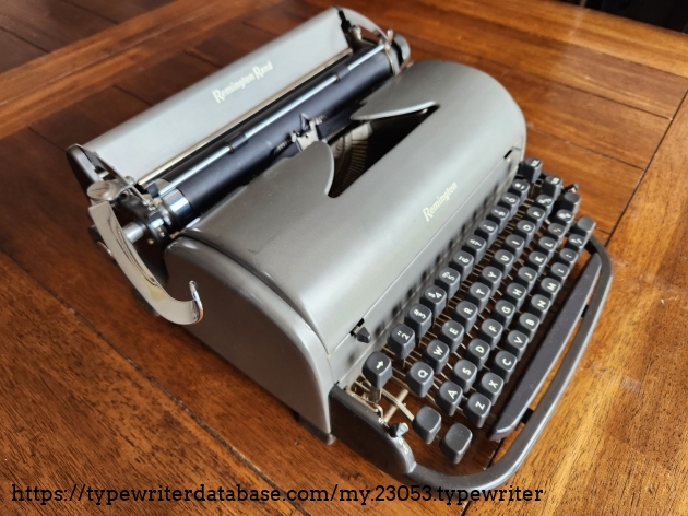 Angle from the front left down onto a gunmetal gray Remington All-New typewriter
