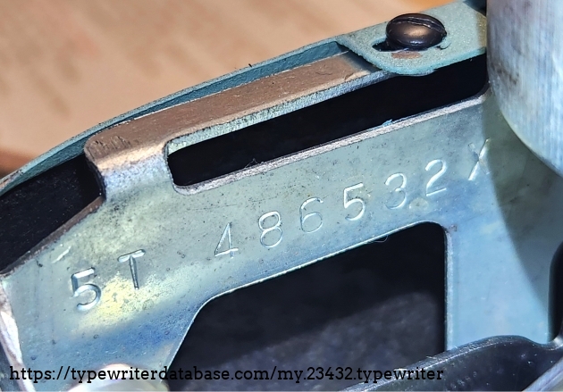 Serial number 5T 486532X. Located on the left side, beneath the ribbon cover.