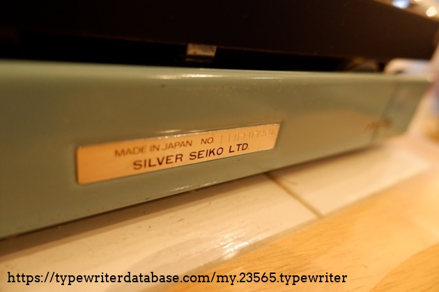 Serial number plate close-up, at the back of the machine (S/N is embossed)