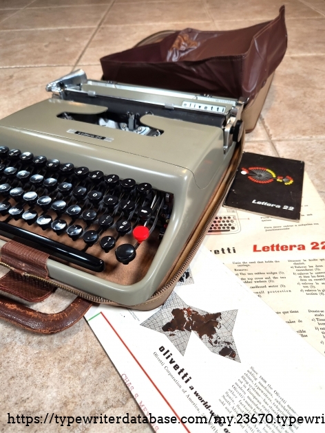 Here you can see the interior flap woven around the case and under the space bar. Doesn't have to be placed exactly that way, but that's where the folds were when I received it. Note the paperwork provided with the typewriter. An overview, a circular, and an instruction pamphlet. This is smaller than the other one I have.