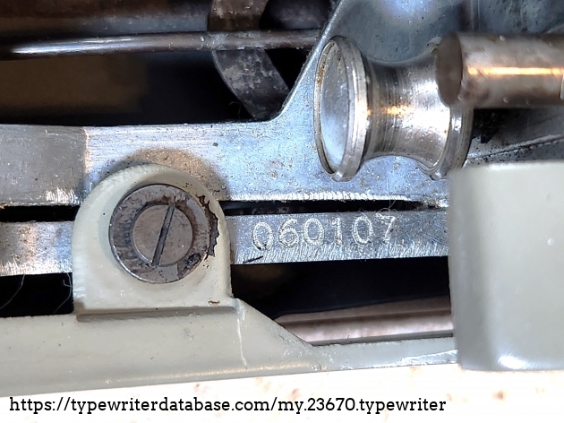 Serial number 060107, found on the frame underneath the right side of the platen by the back carriage roller.