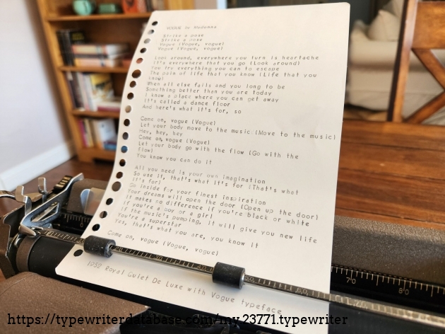 A sheet of paper sitting in the typewriter with the lyrics of Madonna's Vogue typed out in Vogue typeface.