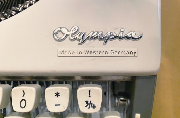 Olympia "SF De Luxe" from the maker logo/country of origin logos on the top...