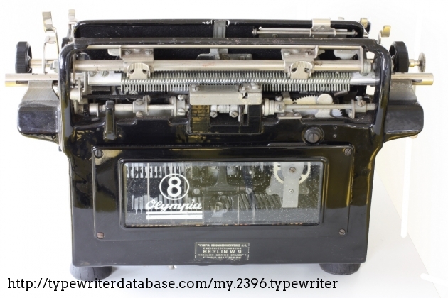 On the back, a great view of the continuos tabulating system, the margin setting levers, and through the glass, the clockworck-like escapement.