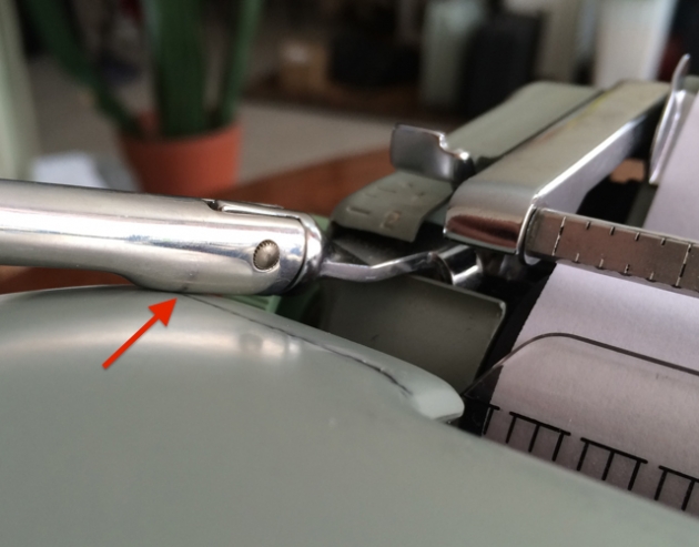 Carriage-return lever rubs on the cover
