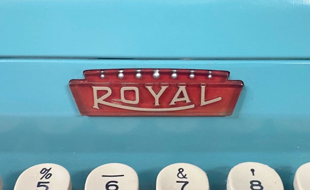 Royal "Quiet De Luxe" from the maker logo on the front... (also, the button to release the ribbon  cover.)