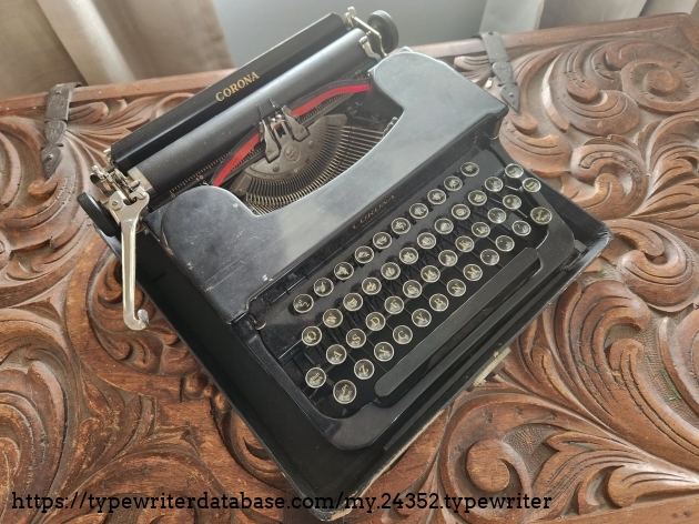 Oblique angle down on a dirty black flat top 1941 Smith-Corona Standard typewriter