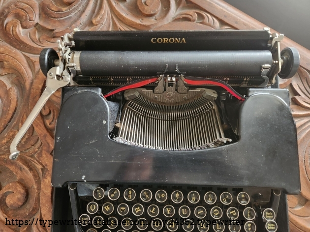 Focus on the rear portion of a dirty 1941 Smith-Corona Standard typewriter