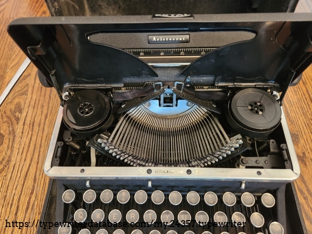 1939 Royal Aristocrat typewriter with hood open and featuring a close up of the basket