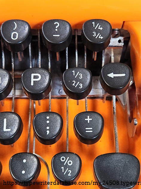 This is a British keyboard, as indicated by the presence of a pound currency symbol and the additional fraction keys, as well as a couple of relocated characters.