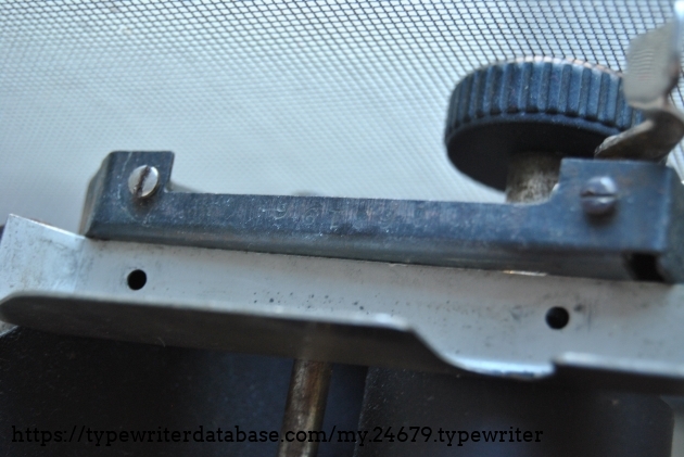 This photo shows the discrepancy between a No. 5 right side carriage plate and the screw mounts on the carriage, which are spaced 3/16 of an inch wider than the corresponding carriage plate (the distance between these screw holes on a No. 5 carriage plate is 2 7/16", whereas the distance between the screw holes on my carriage frame is 2 5/8").