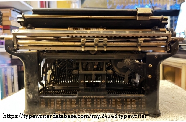 Rear of Underwood No. 5.
(Note missing screw/bolt to right of ratchet knob, directly below rightmost tab.)