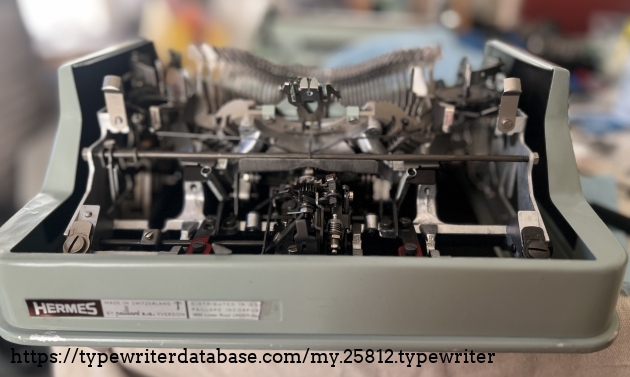 View of escapement of restored typewriter after a deep cleaning. The aluminum frame gleams.