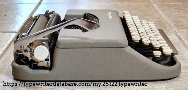 Note the scratch on the ribbon cover from the bottom of the carriage return arm. Note the scratch on the ribbon cover from the bottom of the carriage return arm.