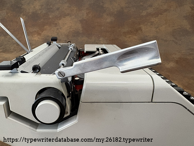 Carriage return lever: extended