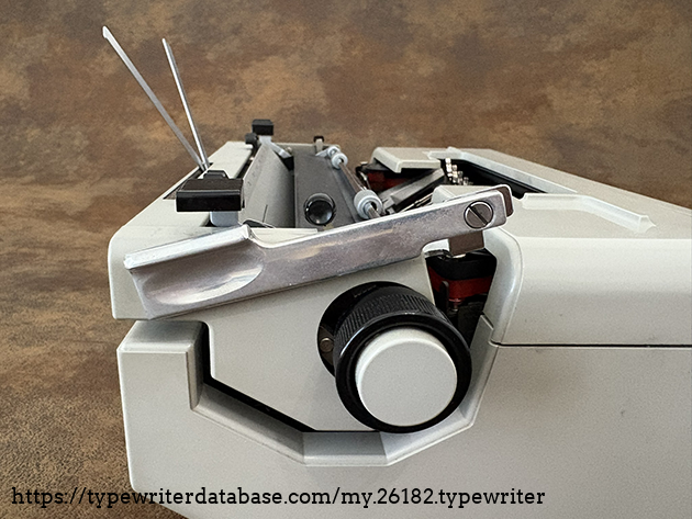 Carriage return lever: stowed