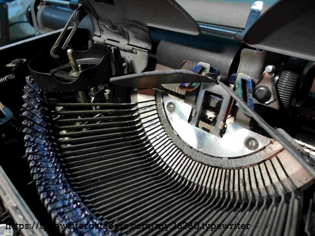 Type slugs of this machine have been blued by the cobalt ribbon that I have used in this typewriter since I got it.  Still needs a cleaning, but the blue looks better than caked-on-black any day.