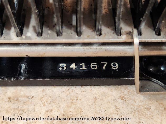 Serial number 34169, located on the bottom rear of the frame, on the inside. Note that the carriage has its own serial number and has often been exchanged, so they may not match. Mine has the same number scratched in it and no other visible, so seems to be original to the unit.