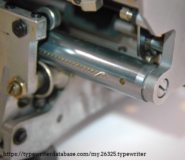 tubular guideway of the carriage between lower wheel and upper roller.
One tab is set: the pin
