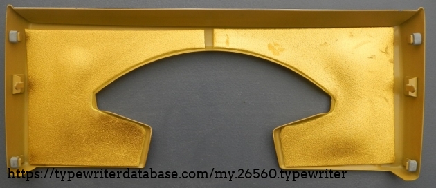 Thin self-adhesive foam applied to the inside of the ribbon cover, where no one can ever see it.