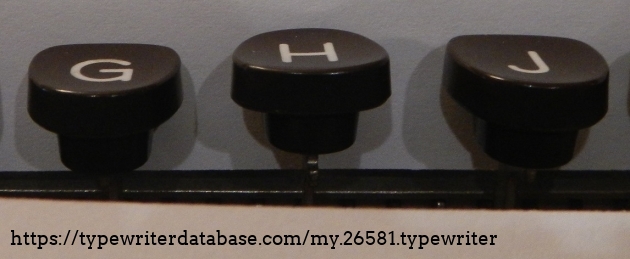 The upside-down H key is higher than the rest of the row.
