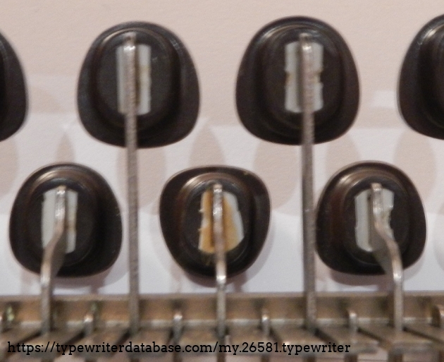 The upside-down H key is obvious from below.