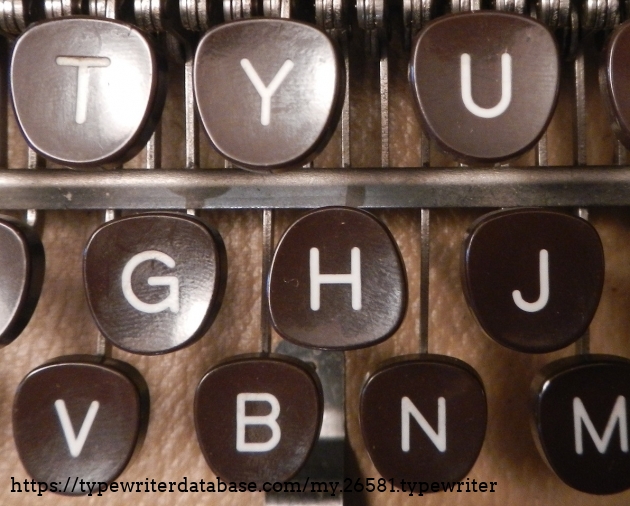 The upside-down H key.
