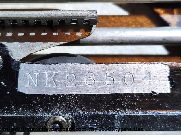 Serial NK26504. Visible by moving the carriage all the way to the left and looking at the exposed right side of the typewriter. Serial NK26504. Visible by moving the carriage all the way to the left and looking at the exposed right side of the typewriter.